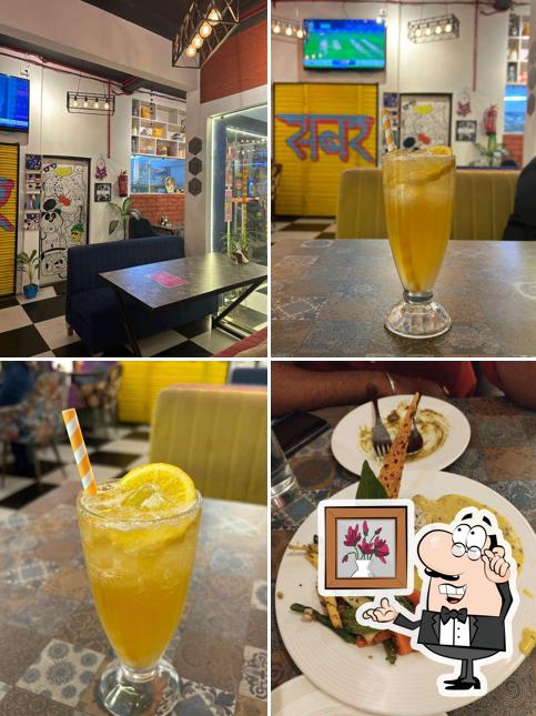Take a seat at one of the tables at Cheese Cherry Pineapple