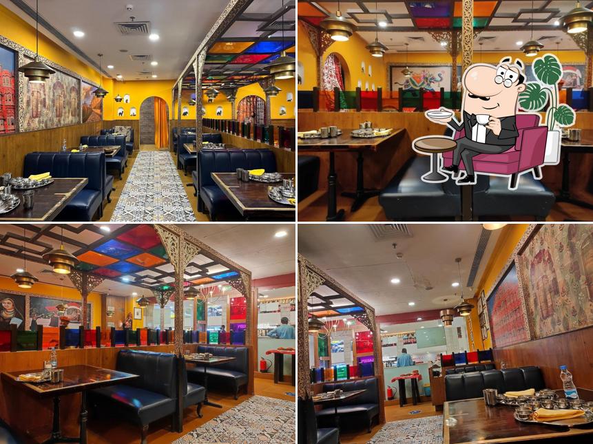 Take a seat at one of the tables at Manbhavan Premium Thali