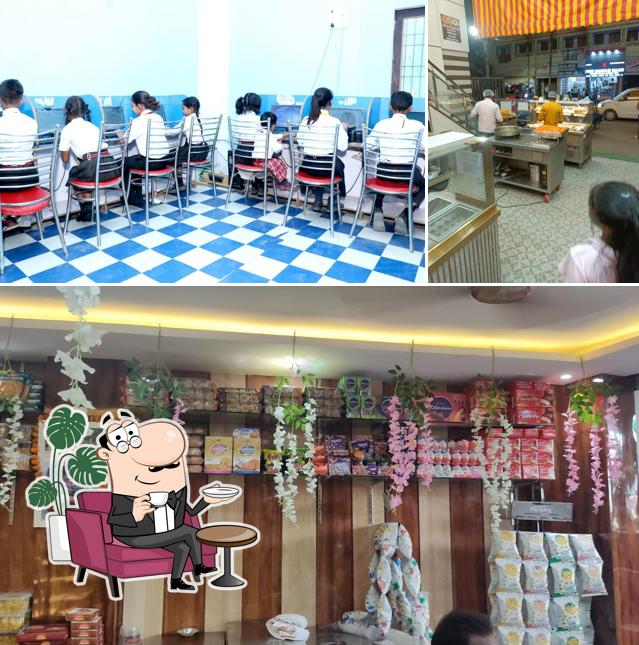 Check out the image depicting interior and food at Sudama Sweets & Fast Food