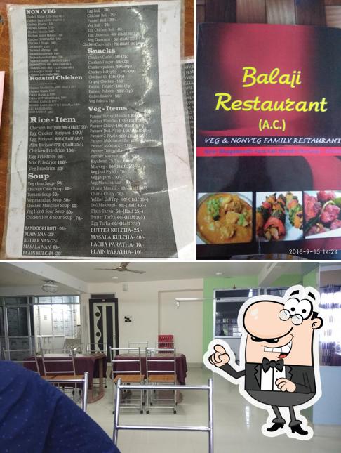 Take a seat at one of the tables at Balaji Hotel & Fast Food