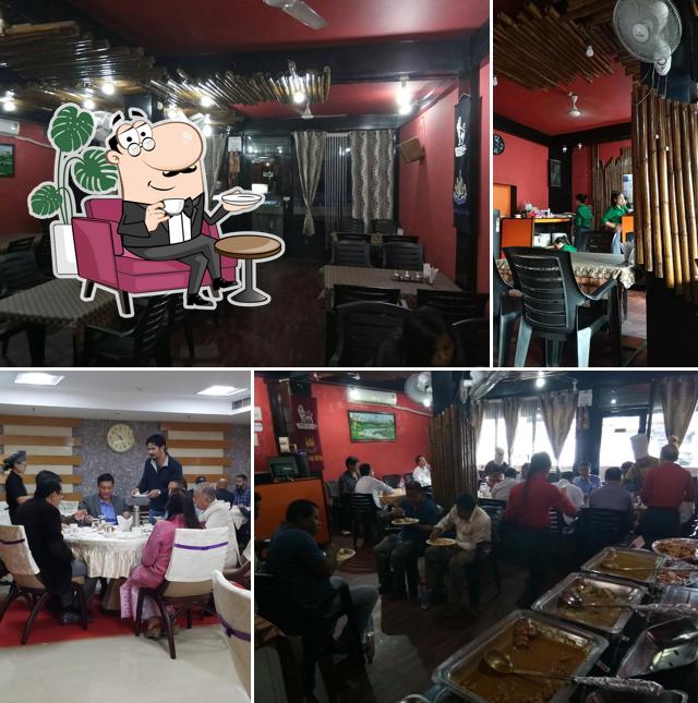 Take a seat at one of the tables at M/s PAPA Family Restaurant