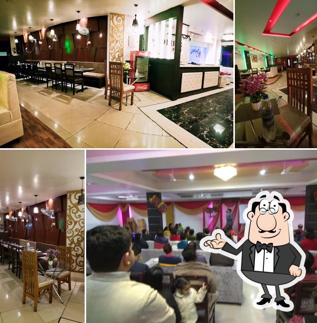 Take a seat at one of the tables at DINING INN HOTEL & RESTAURANT