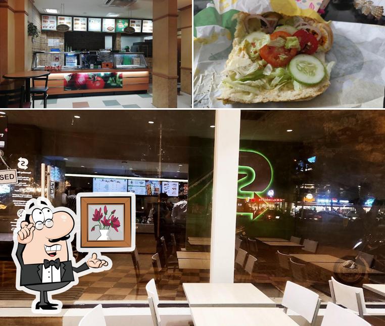 This is the picture displaying interior and food at Subway Panampilly Nagar