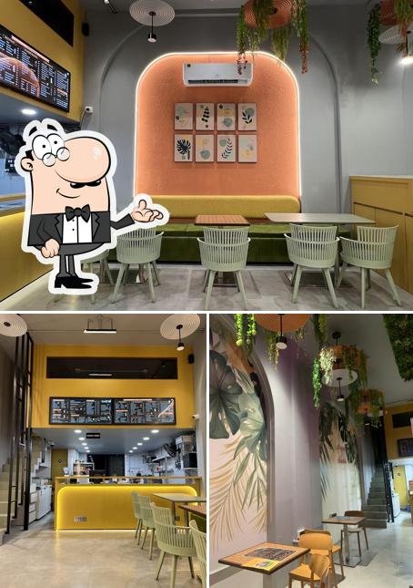 Take a seat at one of the tables at Dessert Villa (Beed bypass)