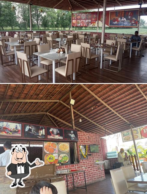 Take a seat at one of the tables at Hotel saiba