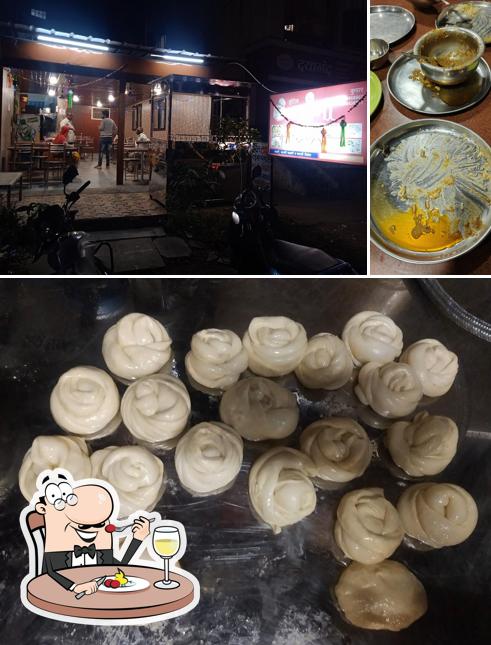 The photo of Hotel Laxmi’s food and exterior