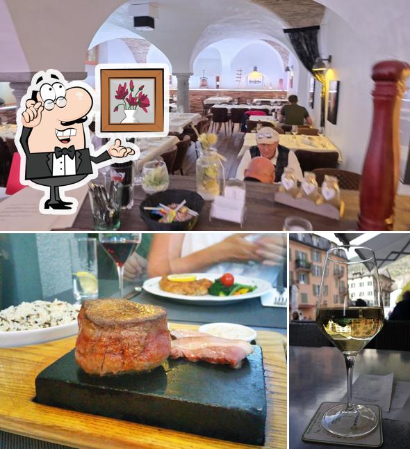 Siediti a un tavolo di Angleterre Steakhouse & Bar