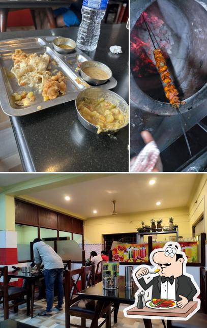 Take a look at the picture showing food and interior at Thakadiyel Restaurant