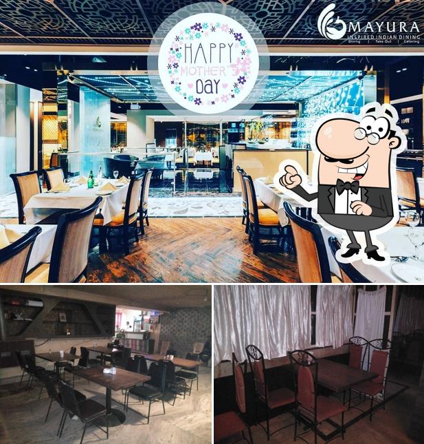 Take a seat at one of the tables at Mayura Fine Dine & Bar