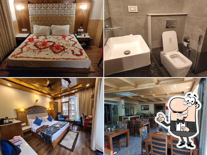 Take a seat at one of the tables at Hotel Suryansh Regency, Manali