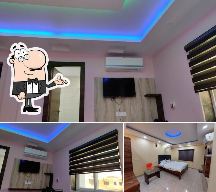 Take a seat at one of the tables at HOTEL RIDHI SIDHI