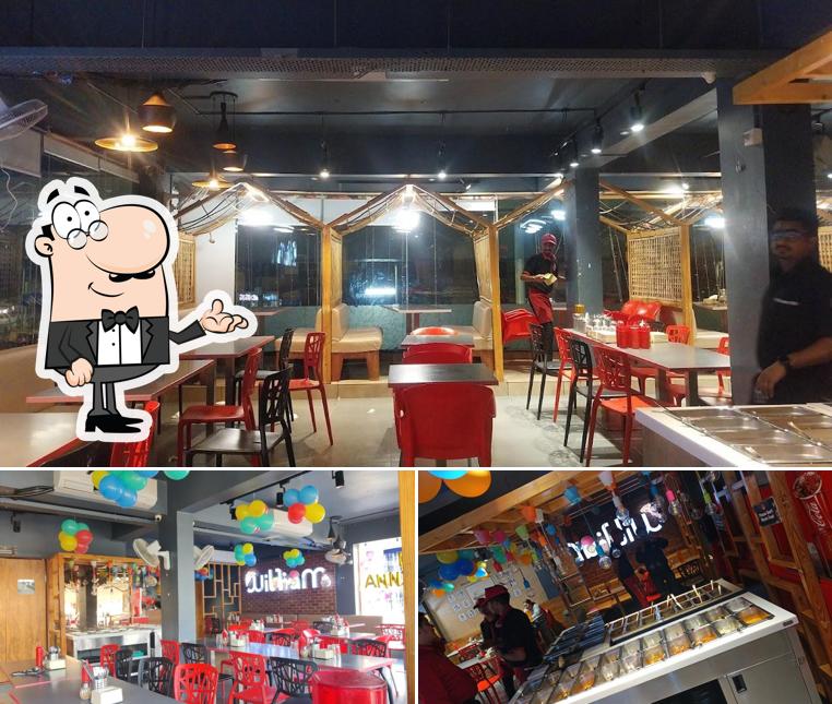 The interior of William John's Pizza Bapunagar