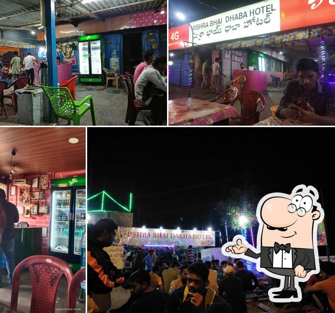 Take a seat at one of the tables at New Mishra Bhai Dhaba