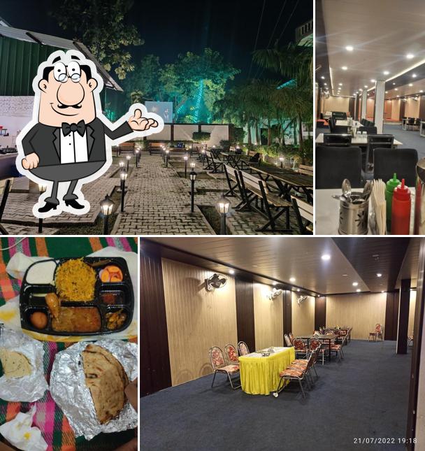 Take a seat at one of the tables at The Food Palace (Family Restaurant & Banquet Hall)