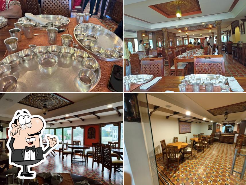 Take a seat at one of the tables at Kesariya Restaurant