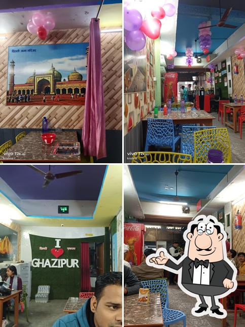 Take a seat at one of the tables at Delhi Darbar Family Restaurant