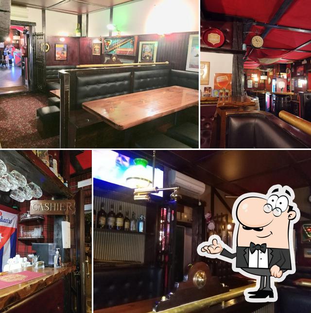 Siediti a un tavolo di Bennigan's Pub 1902