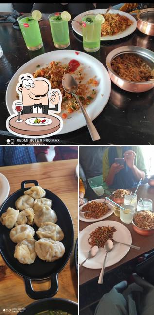 Among different things one can find food and dining table at Roadside Cafe