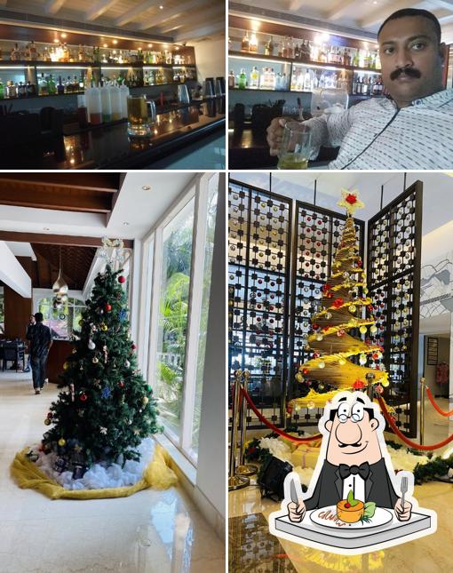 The picture of food and bar counter at Longitude 76 Bar - Le Meridien Kochi