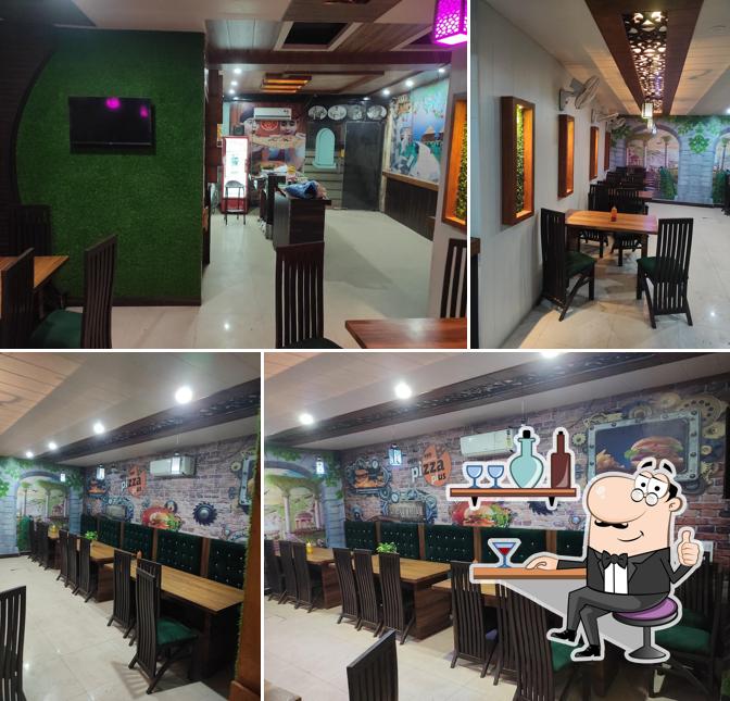 Take a seat at one of the tables at Enjoy Pizza Plus