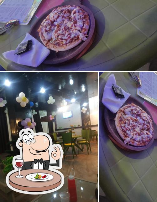 Take a look at the picture depicting food and interior at Groot Restro