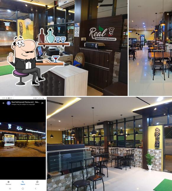 Take a seat at one of the tables at Real Kathiyavadi Restaurant - Best Kathiyawadi Restaurant