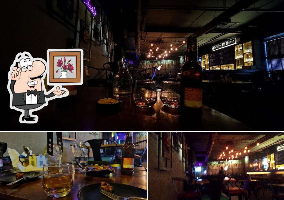 Take a seat at one of the tables at MOB (Ministry Of Booze) - Best Pub In Newtown