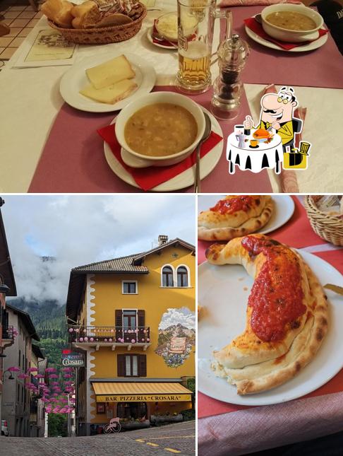 Guarda la immagine che mostra la cibo e esterno di Bar Pizzeria Crosara