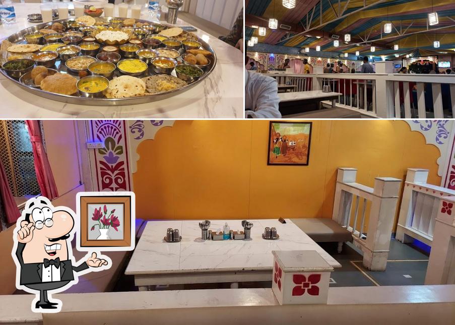 Take a seat at one of the tables at Pakwan Food Tradition Veg Restaurant