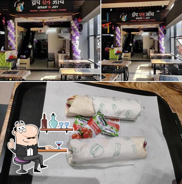 The photo of interior and food at Wrap N Joy