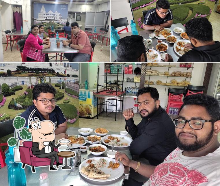Take a seat at one of the tables at Radha's sweets and snacks Chaat of Vrindavan