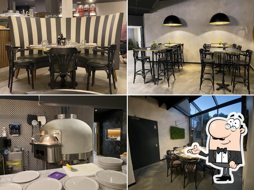 Dai un'occhiata agli interni di Aria pizza & cucina