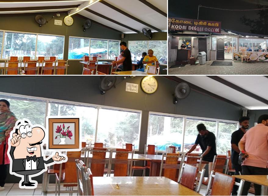 Take a seat at one of the tables at Hotel Kodai Aryaas