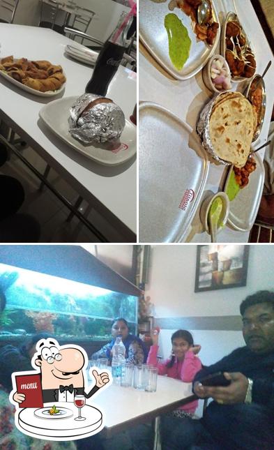 Take a look at the picture displaying food and dining table at Titanic Restaurant