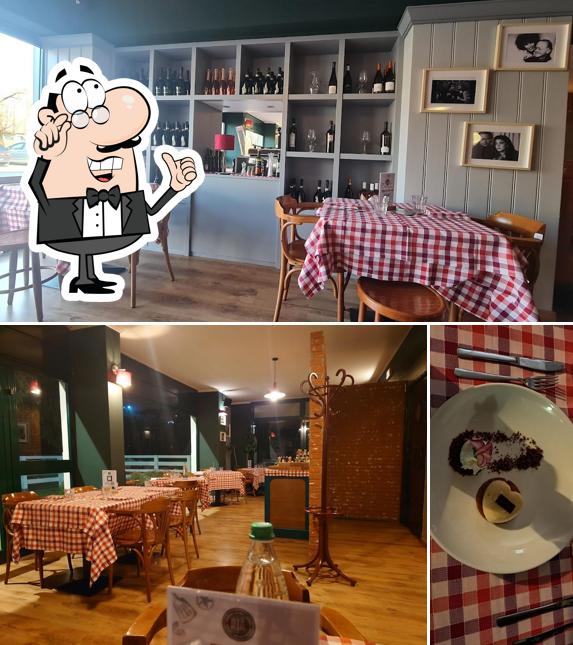 Siediti a un tavolo di Ria Trattoria Pizzeria