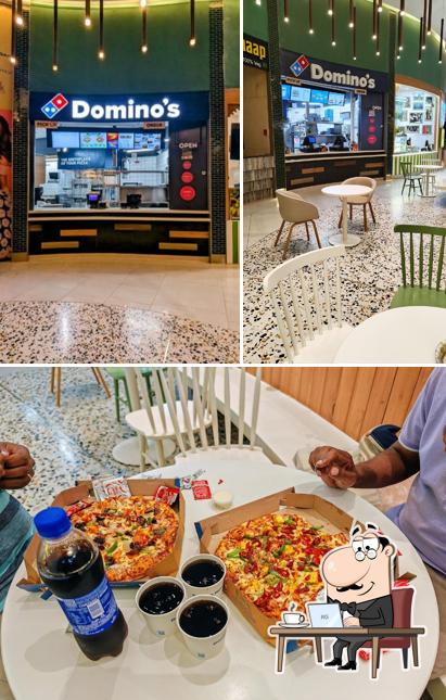 The photo of Domino's Pizza Palladium Mall, Ahmedabad’s interior and food