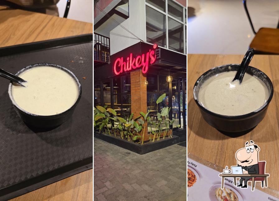 Take a seat at one of the tables at Resto Chikeys Guruvayoor