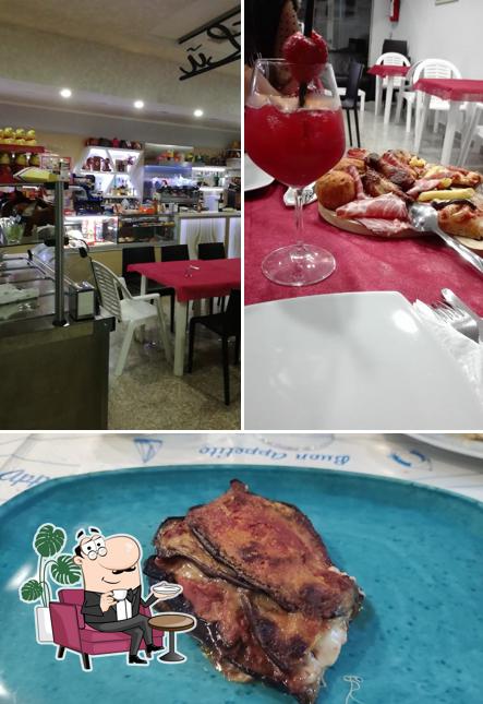 Questa è la immagine che presenta la interni e cibo di DaLù - Bar Pizzetteria Tavola Calda