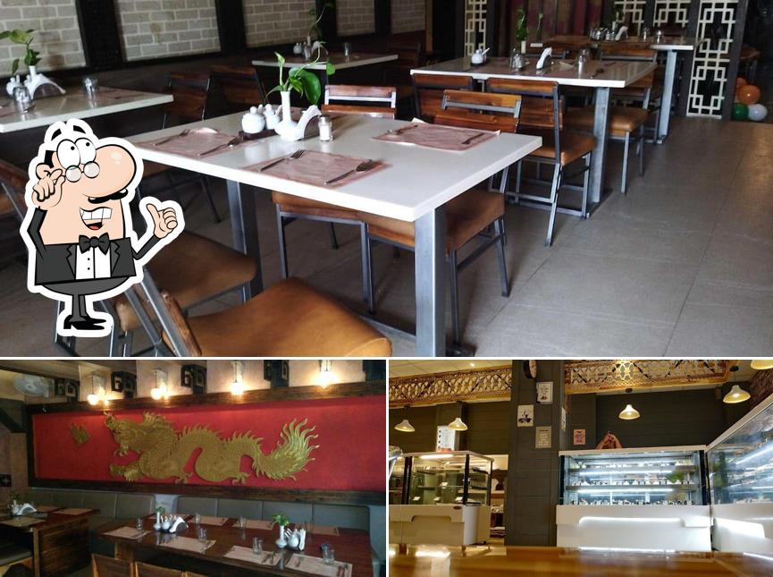 Take a seat at one of the tables at Ming Garden-Restaurant