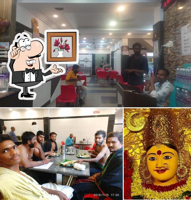 Take a seat at one of the tables at Hotel Ishwarya