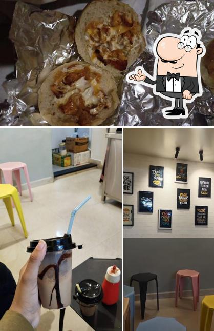 Check out the image showing interior and food at Snacks katta