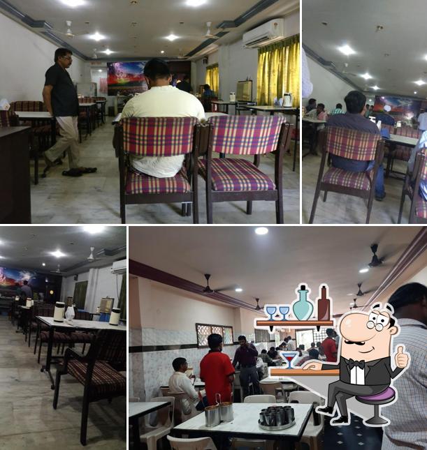 Take a seat at one of the tables at Mourya Hotel