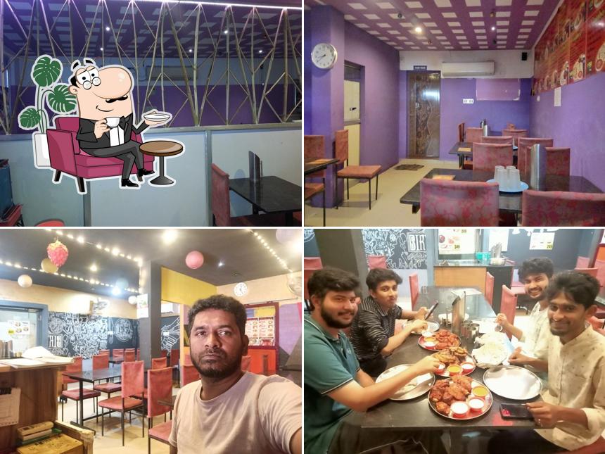 Take a seat at one of the tables at AL HUDA Restaurant