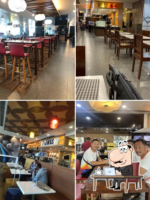 Take a seat at one of the tables at Noodle