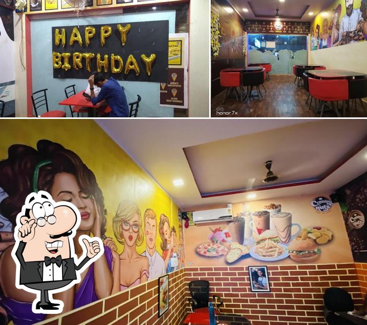 Take a seat at one of the tables at Creamy Nuts Bidar