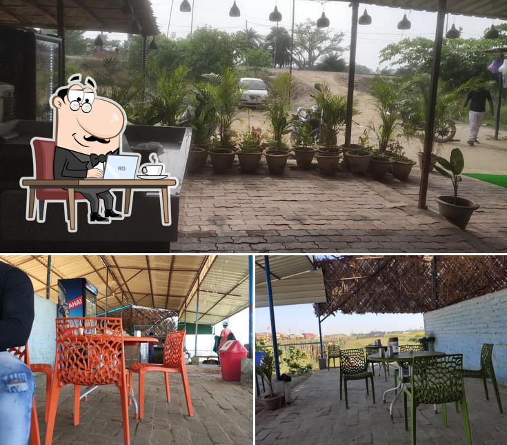 Take a seat at one of the tables at Rinku Hotel Dhaba