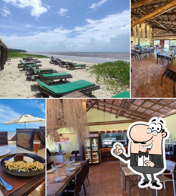 Sente em uma das mesas no Maroca Praia Restaurante