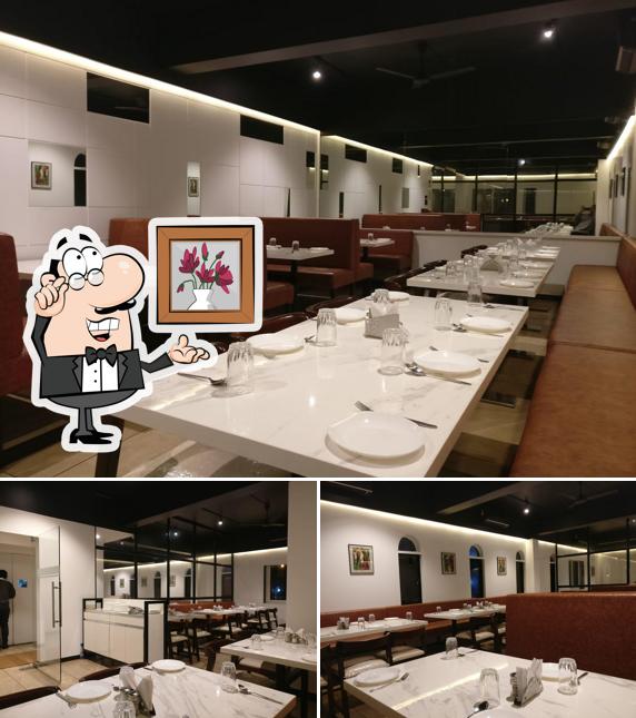 Take a seat at one of the tables at Khyber Restaurant