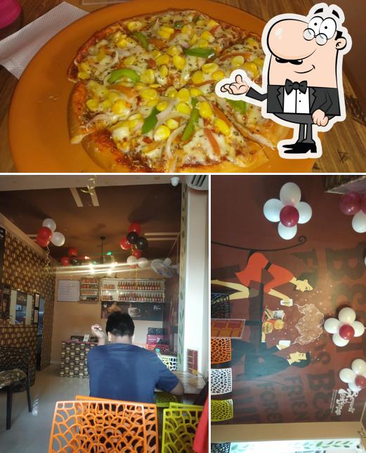 The picture of Beyond Temptation Akola’s interior and pizza