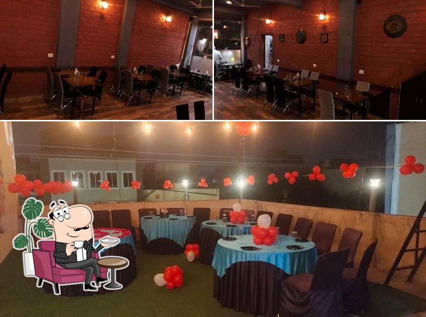 Take a seat at one of the tables at Veerji's Biryani Restaurant